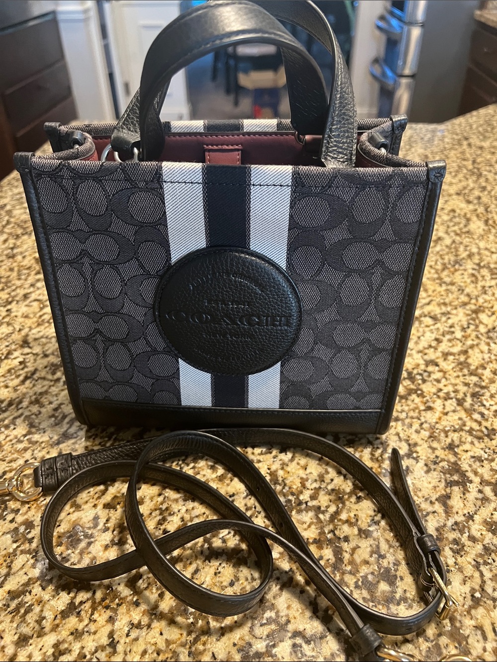 Coach  Dempsey Tote 22  size 7 H x 8 Lx 4D